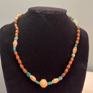 N29. Wooden beaded necklace with turquoise.